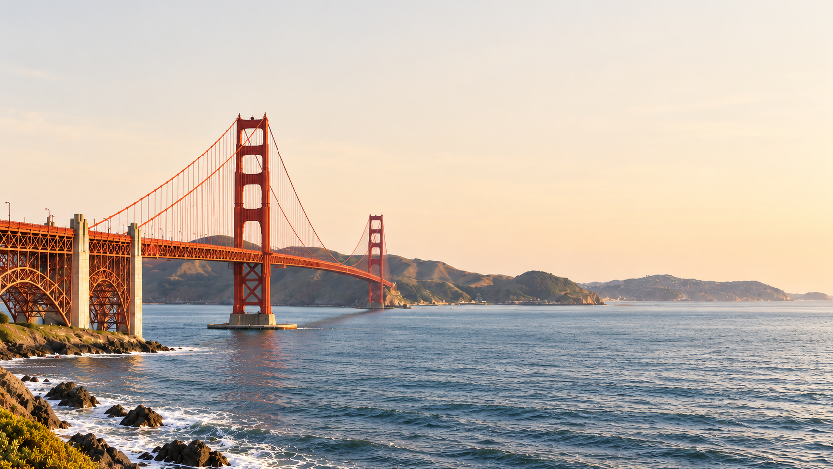 Golden Gate Bridge across San Francisco Bay in warm evening light